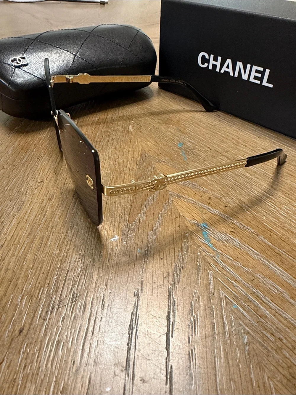 CHANEL Rimless Square Sunglasses in Dark Gradient with Gold Accents